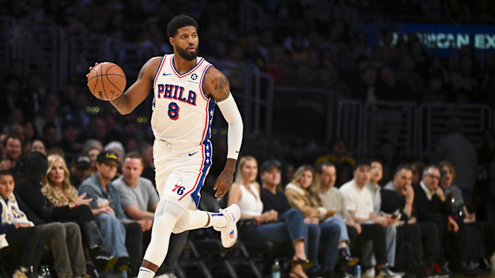 Philadelphia 76ers forward Paul George (8) dribbles against the Los Angeles Lakers during the first half at Crypto.com Arena. Mandatory Credit: Jonathan Hui-Imagn Images