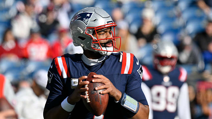 Nov 17, 2024; Foxborough, Massachusetts, USA;  New England Patriots quarterback Jacoby Brissett (7) warms up before a game against the Los Angeles Rams at Gillette Stadium. Mandatory Credit: Eric Canha-Imagn Images