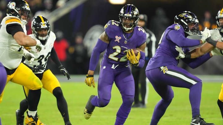 Dec 21, 2024; Baltimore, Maryland, USA; Baltimore Ravens running back Derrick Henry (22) runs for a gain against the Pittsburgh Steelers in the fourth quarter at M&T Bank Stadium. Mandatory Credit: Mitch Stringer-Imagn Images