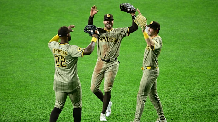 May 2, 2025; Pittsburgh, Pennsylvania, USA; San Diego Padres right fielder Jason Heyward (22), left fielder Brandon Lockridge (28) and center fielder Tyler Wade (14) celebrate after the Padres defeated the Pittsburgh Pirates at PNC Park. Mandatory Credit: David Dermer-Imagn Images
