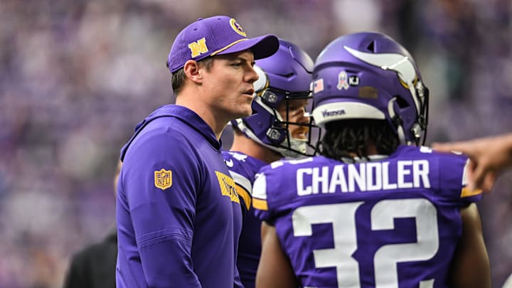 Minnesota Vikings coach Kevin O'Connell talks with running back Ty Chandler before the game against the Arizona Cardinals at U.S. Bank Stadium in Minneapolis on Dec. 1, 2024.