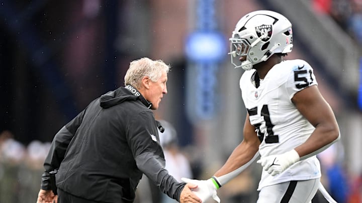 Sep 7, 2025; Foxborough, Massachusetts, USA; Las Vegas Raiders head coach Pete Carroll  reacts with defensive end Malcolm Koonce (51) during the second half at Gillette Stadium. Mandatory Credit: Brian Fluharty-Imagn Images