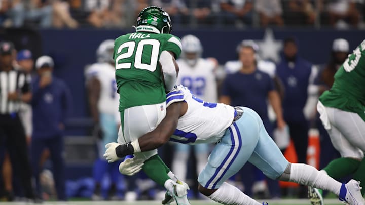 Sep 17, 2023; Arlington, Texas, USA; New York Jets running back Breece Hall (20) is tackled by Dallas Cowboys defensive end DeMarcus Lawrence (90) in the first quarter at AT&T Stadium. Mandatory Credit: Tim Heitman-Imagn Images Sep 17, 2023; Arlington, Texas, USA; New York Jets running back Breece Hall (20) is tackled by Dallas Cowboys defensive end DeMarcus Lawrence (90) in the first quarter at AT&T Stadium. Mandatory Credit: Tim Heitman-Imagn Images