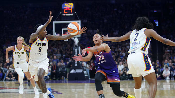Mercury guard Alyssa Thomas (25) gets an assist against Fever forward Natasha Howard (6) at PHX Arena in Phoenix on Aug. 7, 2025. Mercury guard Alyssa Thomas (25) gets an assist against Fever forward Natasha Howard (6) at PHX Arena in Phoenix on Aug. 7, 2025.