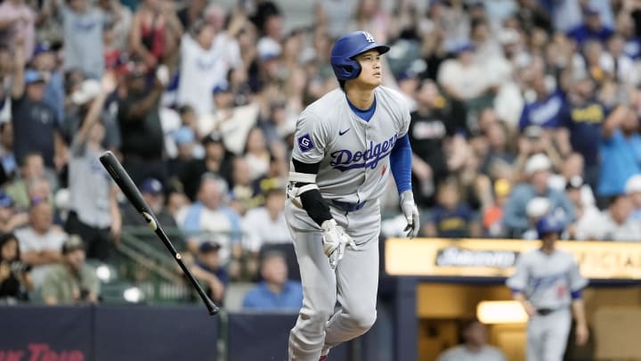 Aug 13, 2024; Milwaukee, Wisconsin, USA;  Los Angeles Dodgers designated hitter Shohei Ohtani (17) flips his bat away after hitting a home run during the third inning against the Milwaukee Brewers at American Family Field. Mandatory Credit: Jeff Hanisch-USA TODAY Sports