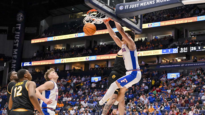 Mar 14, 2025; Nashville, TN, USA;  Florida Gators guard Walter Clayton Jr. (1) dunks the ball against the Missouri Tigers during the first half at Bridgestone Arena. Mandatory Credit: Steve Roberts-Imagn Images