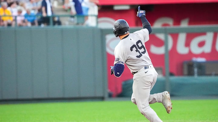 Jun 12, 2024; Kansas City, Missouri, USA; New York Yankees catcher Jose Trevino (39) celebrates toward fans while running the bases after hitting a three run home run against the Kansas City Royals in the first inning  at Kauffman Stadium. Mandatory Credit: Denny Medley-Imagn Images