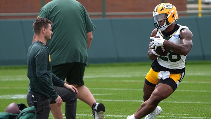Jun 11, 2024; Green Bay, WI, USA; Green Bay Packers running back AJ Dillon (28) carries during minicamp. Mandatory Credit: Mark Hoffman-Imagn Images
