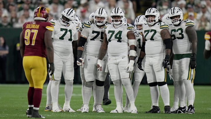 The Green Bay Packers offensive line is shown during the first quarter of their game against the Washington Commanders Thursday, September 11, 2025 at Lambeau Field in Green Bay, Wisconsin. Shown are offensive tackle Anthony Belton (71), guard Sean Rhyan (75), guard Elgton Jenkins (74), offensive tackle Jordan Morgan (77) and offensive tackle Rasheed Walker (63).
