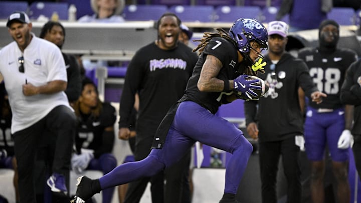Nov 29, 2025; Fort Worth, Texas, TCU Horned Frogs wide receiver Jordan Dwyer (7) catches a pass and runs for a touchdown against the Cincinnati Bearcats during the first half at Amon G. Carter Stadium. Mandatory Credit: Jerome Miron-Imagn Images
