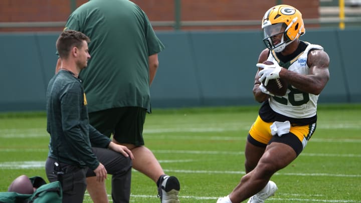 Green Bay Packers running back AJ Dillon shows off a new physique at minicamp.