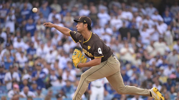 Oct 11, 2024; Los Angeles, California, USA; San Diego Padres pitcher Yu Darvish (11) pitches in the first inning against the Los Angeles Dodgers during game five of the NLDS for the 2024 MLB Playoffs at Dodger Stadium. Mandatory Credit: Jayne Kamin-Oncea-Imagn Images