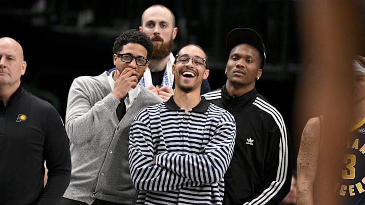 Oct 29, 2025; Dallas, Texas, USA; Indiana Pacers guard Tyrese Haliburton (left) and guard Andrew Nembhard (center) laugh on the sidelines during the second half of the game against the Dallas Mavericks at the American Airlines Center. Mandatory Credit: Jerome Miron-Imagn Images