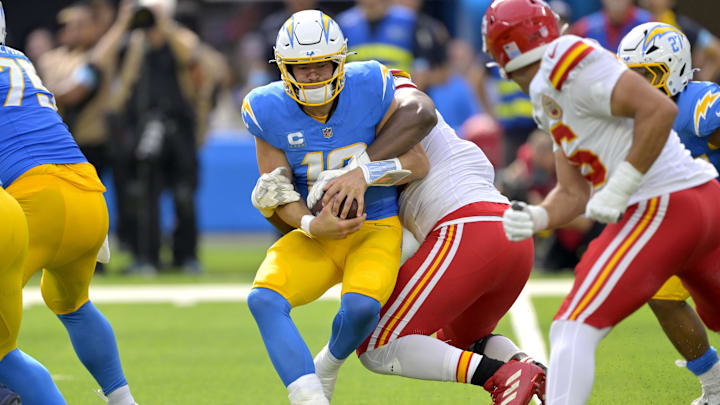 Sep 29, 2024; Inglewood, California, USA; Los Angeles Chargers quarterback Justin Herbert (10) is sacked by Kansas City Chiefs defensive tackle Chris Jones (95) in the first half at SoFi Stadium. Mandatory Credit: Jayne Kamin-Oncea-Imagn Images Sep 29, 2024; Inglewood, California, USA; Los Angeles Chargers quarterback Justin Herbert (10) is sacked by Kansas City Chiefs defensive tackle Chris Jones (95) in the first half at SoFi Stadium. Mandatory Credit: Jayne Kamin-Oncea-Imagn Images