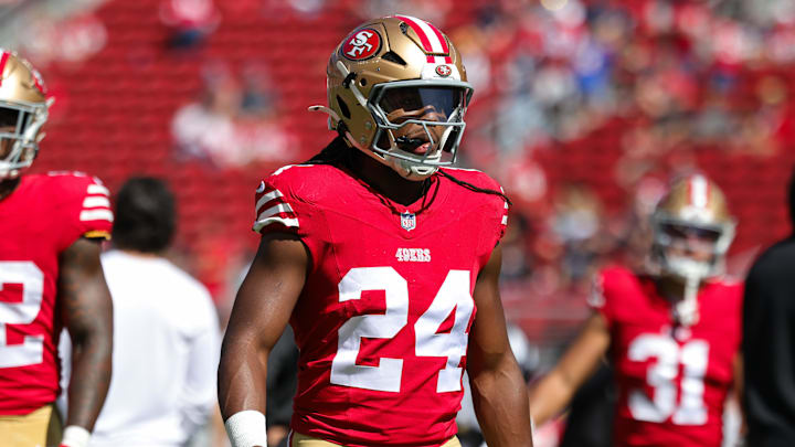 Jordan Mason warms up before a game last season as a member of the 49ers. 