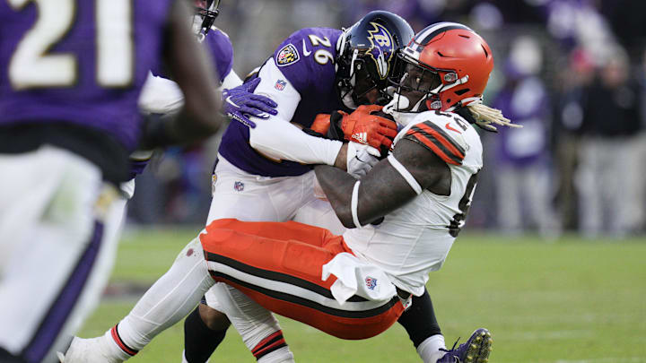 Nov 12, 2023; Baltimore, Maryland, USA; Baltimore Ravens safety Geno Stone (26) tackles Cleveland