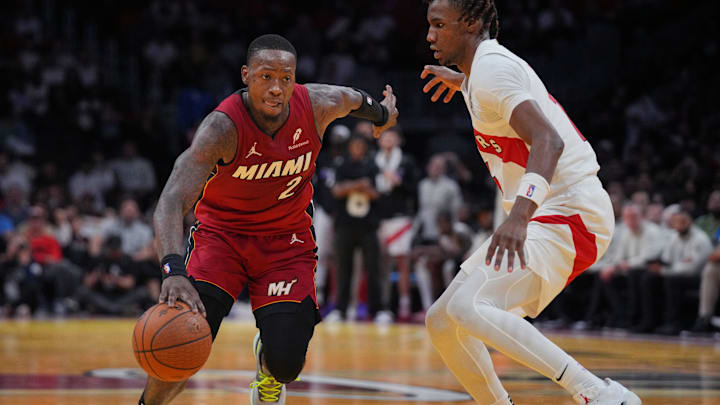 Nov 29, 2024; Miami, Florida, USA; Miami Heat guard Terry Rozier (2) drives past Toronto Raptors guard Ja'Kobe Walter (14) during the second half in an NBA Cup game at Kaseya Center. Mandatory Credit: Jim Rassol-Imagn Images Nov 29, 2024; Miami, Florida, USA; Miami Heat guard Terry Rozier (2) drives past Toronto Raptors guard Ja'Kobe Walter (14) during the second half in an NBA Cup game at Kaseya Center. Mandatory Credit: Jim Rassol-Imagn Images
