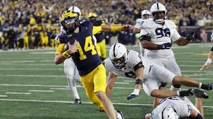 Oct 17, 2026; Ann Arbor, Michigan, USA; Michigan Wolverines quarterback Tommy Carr (14) runs the ball in for a touchdown in the second half against the Penn State Nittany Lions at Michigan Stadium. Mandatory Credit: Rick Osentoski-Imagn Images Oct 17, 2026; Ann Arbor, Michigan, USA; Michigan Wolverines quarterback Tommy Carr (14) runs the ball in for a touchdown in the second half against the Penn State Nittany Lions at Michigan Stadium. Mandatory Credit: Rick Osentoski-Imagn Images
