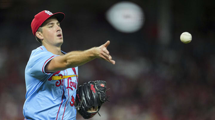 Aug 30, 2025; Cincinnati, Ohio, USA; St. Louis Cardinals pitcher Michael McGreevy (36) throws out Cincinnati Reds third baseman Ke'Bryan Hayes (3) at first base in the sixth inning at Great American Ball Park. Mandatory Credit: Aaron Doster-Imagn Images