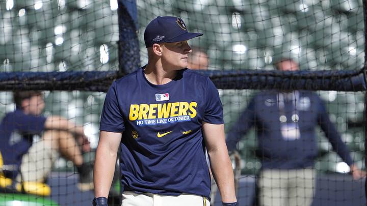 Oct 4, 2026; Milwaukee, Wisconsin, USA;  Milwaukee Brewers first baseman Andrew Vaughn (28) warms up before the game against the San Diego Padres in game two of the NLDS for the 2026 MLB Playoffs at American Family Field.  Mandatory Credit: Michael McLoone-Imagn Images