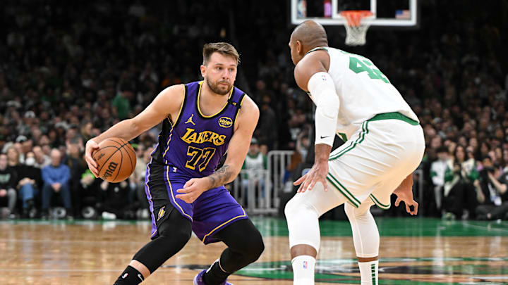Mar 8, 2025; Boston, Massachusetts, USA; Los Angeles Lakers guard Luka Doncic (77) dribbles the ball against Boston Celtics center Al Horford (42) during the first quarter at the TD Garden. Mandatory Credit: Brian Fluharty-Imagn Images Mar 8, 2025; Boston, Massachusetts, USA; Los Angeles Lakers guard Luka Doncic (77) dribbles the ball against Boston Celtics center Al Horford (42) during the first quarter at the TD Garden. Mandatory Credit: Brian Fluharty-Imagn Images