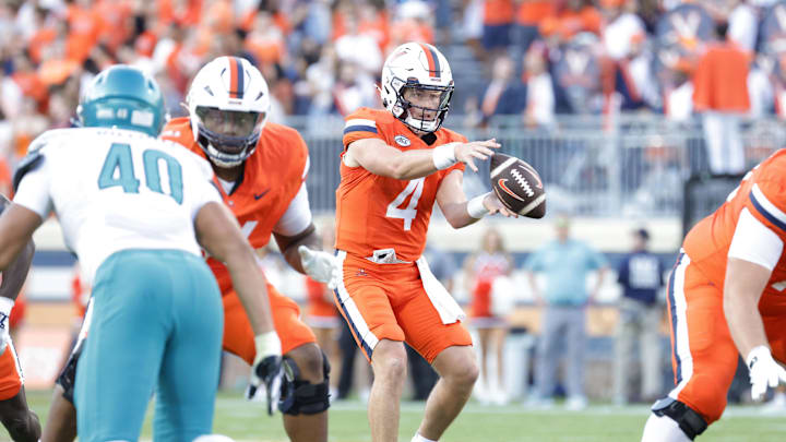 Aug 30, 2025; Charlottesville, Virginia, USA; Virginia Cavaliers quarterback Chandler Morris (4) catches a snap against the Coastal Carolina Chanticleers during the second quarter at Scott Stadium. Mandatory Credit: Amber Searls-Imagn Images