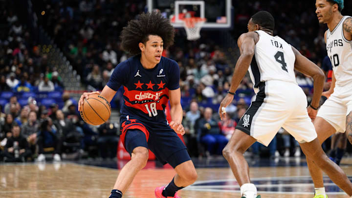Feb 10, 2025; Washington, District of Columbia, USA; Washington Wizards forward Kyshawn George (18) handles the ball against San Antonio Spurs guard De'Aaron Fox (4) during the first quarter at Capital One Arena. Mandatory Credit: Reggie Hildred-Imagn Images Feb 10, 2025; Washington, District of Columbia, USA; Washington Wizards forward Kyshawn George (18) handles the ball against San Antonio Spurs guard De'Aaron Fox (4) during the first quarter at Capital One Arena. Mandatory Credit: Reggie Hildred-Imagn Images