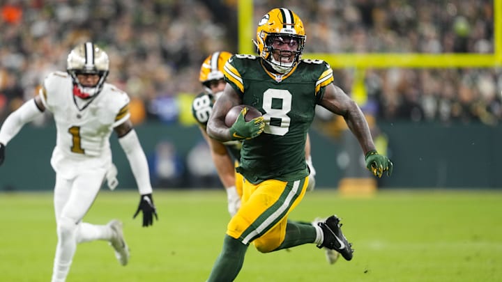 Green Bay Packers running back Josh Jacobs breaks into the open field against the Saints last season.