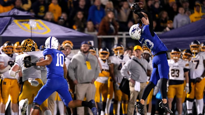St. Xavier Bombers defensive back Brayden Reilly (23) intercepts a pass intended for Moeller Crusaders Eli Jacon Duffy (8) in the first half of a second-round Division I OHSAA high school football game, Friday, Nov. 3, 2023, at St. Xavier High School   s RDI Field in Cincinnati. St. Xavier Bombers defensive back Brayden Reilly (23) intercepts a pass intended for Moeller Crusaders Eli Jacon Duffy (8) in the first half of a second-round Division I OHSAA high school football game, Friday, Nov. 3, 2023, at St. Xavier High School   s RDI Field in Cincinnati.