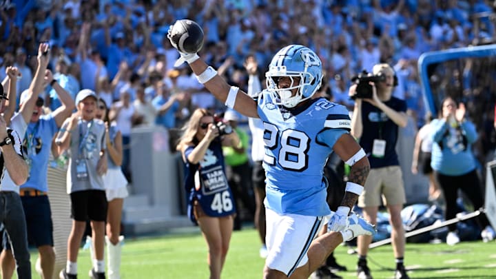 Oct 12, 2024; Chapel Hill, North Carolina, USA; North Carolina Tar Heels running back Omarion Hampton (28) runs for a touchdown in the third quarter at Kenan Memorial Stadium. Mandatory Credit: Bob Donnan-Imagn Images