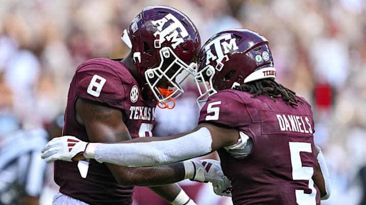 Oct 5, 2024; College Station, Texas, USA; Texas A&M Aggies running back Le'Veon Moss (8) celebrates after scoring a touchdown with running back Amari Daniels (5) in the fourth quarter against the Missouri Tigers at Kyle Field. Mandatory Credit: Maria Lysaker-Imagn Images. 