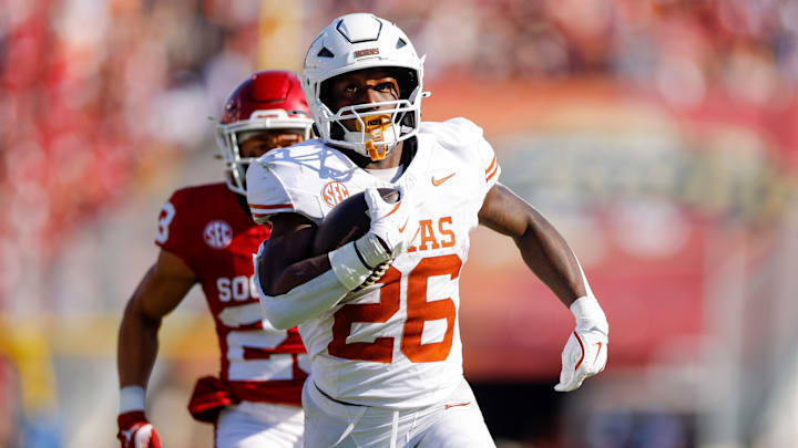 Oct 12, 2024; Dallas, Texas, USA; Texas Longhorns running back Quintrevion Wisner (26) breaks a run for a touchdown during the second quarter against the Oklahoma Sooners at the Cotton Bowl. Mandatory Credit: Andrew Dieb-Imagn Images