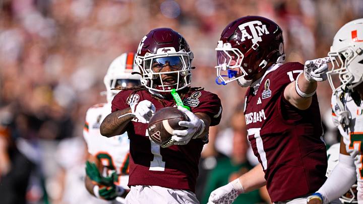 Dec 20, 2025; College Station, TX, USA; Texas A&M Aggies wide receiver Mario Craver (1) and tight end Theo Melin Ohrstrom (17) celebrate during the game between the Aggies and the Hurricanes at Kyle Field. Mandatory Credit: Jerome Miron-Imagn Images