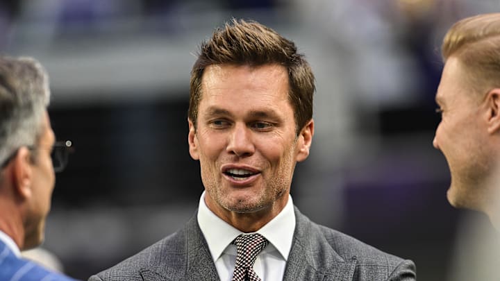 Dec 29, 2024; Minneapolis, Minnesota, USA;  FOX broadcaster and former NFL quarterback Tom Brady looks on before the game between the Minnesota Vikings and the Green Bay Packers at U.S. Bank Stadium. 