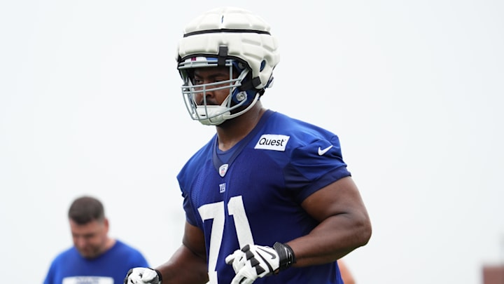 Jul 25, 2024; East Rutherford, NY, USA; New York Giants offensive tackle Marcellus Johnson (71) jogs to the sideline during training camp at Quest Diagnostics Training Center. Mandatory Credit: Lucas Boland-Imagn Images Jul 25, 2024; East Rutherford, NY, USA; New York Giants offensive tackle Marcellus Johnson (71) jogs to the sideline during training camp at Quest Diagnostics Training Center. Mandatory Credit: Lucas Boland-Imagn Images