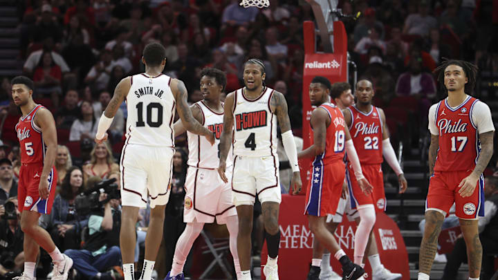 Mar 17, 2025; Houston, Texas, USA; Houston Rockets guard Jalen Green (4) reacts with forward Jabari Smith Jr. (10) after a play during overtime against the Philadelphia 76ers at Toyota Center. Mandatory Credit: Troy Taormina-Imagn Images