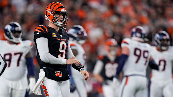 Cincinnati Bengals quarterback Joe Burrow (9) looks to the video board to see a replay of himself being sacked in the third quarter of the NFL Week 17 game between the Cincinnati Bengals and the Denver Broncos at Paycor Stadium in downtown Cincinnati on Saturday, Dec. 28, 2024. The Bengals took a 30-24 win in overtime to remain in the post season chase. Cincinnati Bengals quarterback Joe Burrow (9) looks to the video board to see a replay of himself being sacked in the third quarter of the NFL Week 17 game between the Cincinnati Bengals and the Denver Broncos at Paycor Stadium in downtown Cincinnati on Saturday, Dec. 28, 2024. The Bengals took a 30-24 win in overtime to remain in the post season chase.