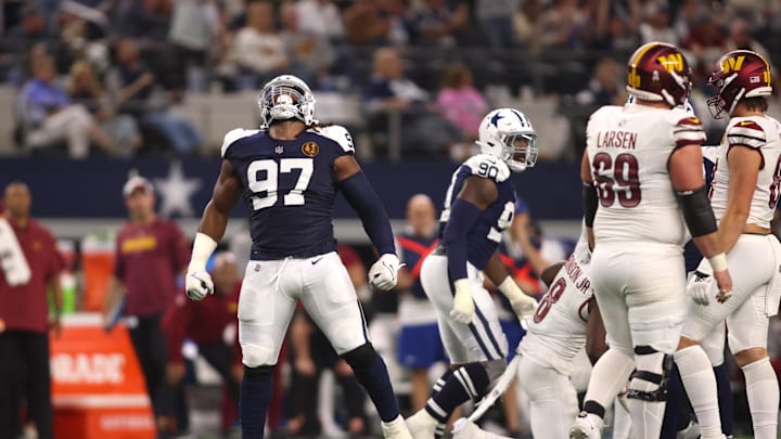 Nov 23, 2023; Arlington, Texas, USA; Dallas Cowboys defensive tackle Osa Odighizuwa (97) celebrates a sack in the second half against the Washington Commanders at AT&T Stadium. Mandatory Credit: Tim Heitman-Imagn Images