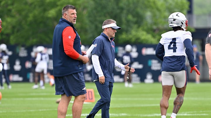 Jun 9, 2025; Foxborough, MA, USA; New England Patriots head coach Mike Vrabel (L) and offensive coordinator Josh McDaniels (R) watch over practice during minicamp at Gillette Stadium. Mandatory Credit: Eric Canha-Imagn Images