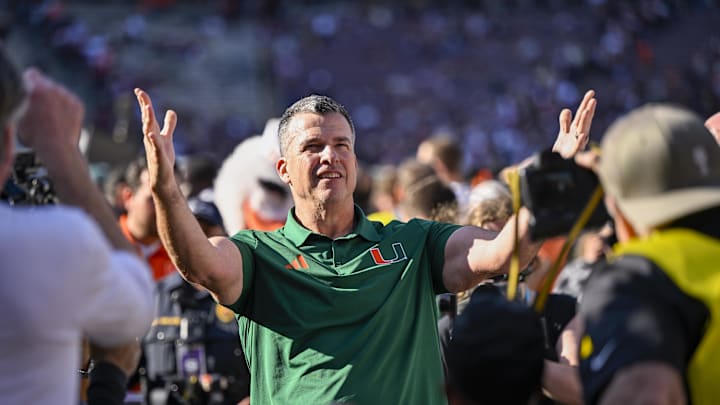 Dec 20, 2025; College Station, TX, USA; Miami Hurricanes head coach Mario Cristobal celebrates as he walks off the field after the Hurricanes win over the Texas A&M Aggies at Kyle Field. Mandatory Credit: Jerome Miron-Imagn Images