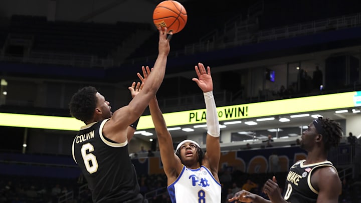 Jan 27, 2026; Pittsburgh, Pennsylvania, USA;  Wake Forest Demon Deacons guard Myles Colvin (6) shoots against Pittsburgh Panthers guard Omari Witherspoon (8) during the second half at the Petersen Events Center. Mandatory Credit: Charles LeClaire-Imagn Images