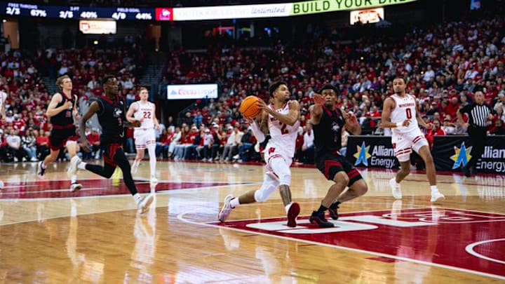 Wisconsin Badgers senior guard Nick Boyd drives to the rim in the first half against Northern Illinois guard Makhai Valentine in a nonconference game at the Kohl Center on November 7, 2025.