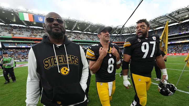 Sep 28, 2025; Dublin, Ireland; Pittsburgh Steelers coach Mike Tomlin (left), quarterback Aaron Rodgers (center) and defensive tackle Cameron Heyward (97) leave the field after an NFL International Series game against the Minnesota Vikings at Croke Park. Mandatory Credit: Kirby Lee-Imagn Images