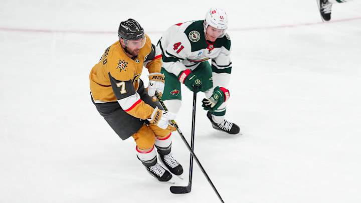 Apr 20, 2025; Las Vegas, Nevada, USA; Vegas Golden Knights defenseman Alex Pietrangelo (7) skates against Minnesota Wild center Gustav Nyquist (41) during the third period of game one of the first round of the 2025 Stanley Cup Playoffs at T-Mobile Arena. Mandatory Credit: Stephen R. Sylvanie-Imagn Images