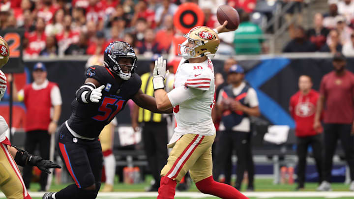 Oct 26, 2025; Houston, Texas, USA; San Francisco 49ers quarterback Mac Jones (10) throws the ball under pressure from Houston Texans defensive end Will Anderson Jr. (51) during the first quarter at NRG Stadium. Mandatory Credit: Troy Taormina-Imagn Images Oct 26, 2025; Houston, Texas, USA; San Francisco 49ers quarterback Mac Jones (10) throws the ball under pressure from Houston Texans defensive end Will Anderson Jr. (51) during the first quarter at NRG Stadium. Mandatory Credit: Troy Taormina-Imagn Images