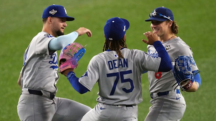 Oct 25, 2025; Toronto, Ontario, CAN; Los Angeles Dodgers center fielder Andy Pages (44) and center fielder Justin Dean (75) and first baseman Enrique Hernandez (8) celebrate after the win against the Toronto Blue Jays in game two of the 2025 MLB World Series at Rogers Centre. Mandatory Credit: Nick Turchiaro-Imagn Images Oct 25, 2025; Toronto, Ontario, CAN; Los Angeles Dodgers center fielder Andy Pages (44) and center fielder Justin Dean (75) and first baseman Enrique Hernandez (8) celebrate after the win against the Toronto Blue Jays in game two of the 2025 MLB World Series at Rogers Centre. Mandatory Credit: Nick Turchiaro-Imagn Images