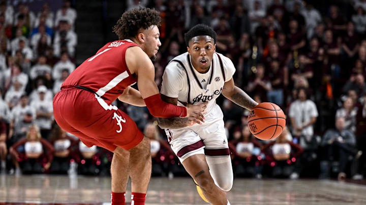 Mar 4, 2023; College Station, Texas, USA; Texas A&M Aggies guard Wade Taylor IV (4) controls the ball as Alabama Crimson Tide guard Mark Sears (1) defends during the second half at Reed Arena. Mandatory Credit: Maria Lysaker-Imagn Images Mar 4, 2023; College Station, Texas, USA; Texas A&M Aggies guard Wade Taylor IV (4) controls the ball as Alabama Crimson Tide guard Mark Sears (1) defends during the second half at Reed Arena. Mandatory Credit: Maria Lysaker-Imagn Images