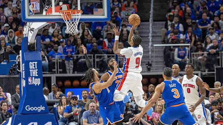 Apr 27, 2025; Detroit, Michigan, USA; Detroit Pistons forward Ausar Thompson (9) drives to the basket as New York Knicks guard Jalen Brunson (11) and center Mitchell Robinson (23) defend during the second quarter of game four of first round for the 2025 NBA Playoffs at Little Caesars Arena. Mandatory Credit: David Reginek-Imagn Images