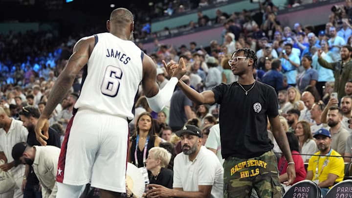 Aug 8, 2024; Paris, France; United States guard LeBron James (6) shakes hands with son Bryce James against Serbia in a men's basketball semifinal game during the Paris 2024 Olympic Summer Games at Accor Arena. Aug 8, 2024; Paris, France; United States guard LeBron James (6) shakes hands with son Bryce James against Serbia in a men's basketball semifinal game during the Paris 2024 Olympic Summer Games at Accor Arena.