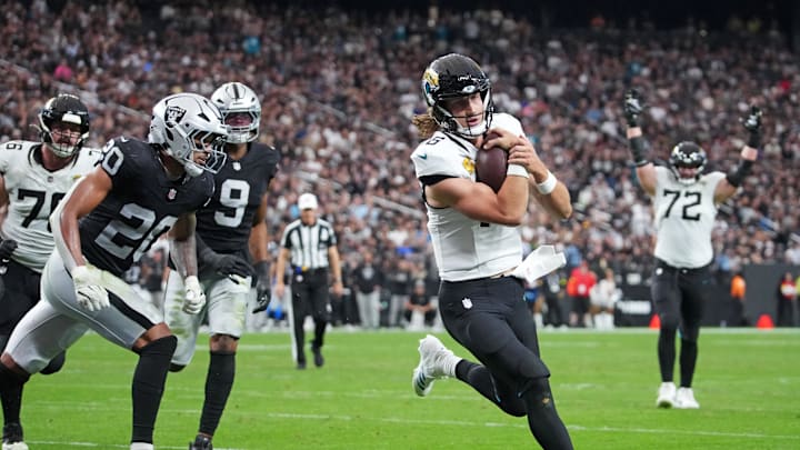 Nov 2, 2025; Paradise, Nevada, USA; Jacksonville Jaguars quarterback Trevor Lawrence (16) scores a touchdown during the second half against the Las Vegas Raiders at Allegiant Stadium. Mandatory Credit: Kirby Lee-Imagn Images